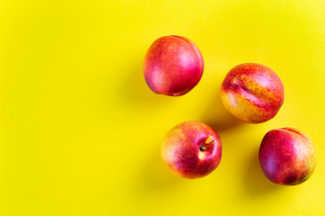 fresh nectarine on a yellow background