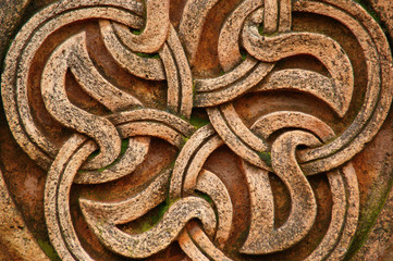 a fragment of an ornament carved in stone