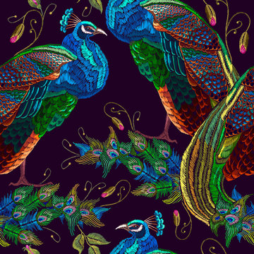 Embroidery peacocks seamless pattern. Fashionable template for design of clothes. Tails of tropical birds art