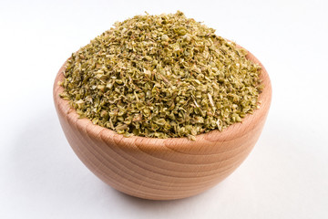 Fototapeta na wymiar oregano herb in wooden bowl isolated on white background.
