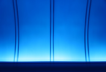 Futuristic tunnel with blue illumination texture background
