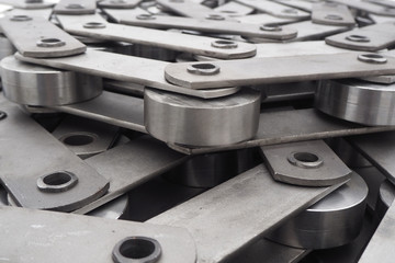 Pulling block conveyor chain close-up. Technology of mechanical engineering.