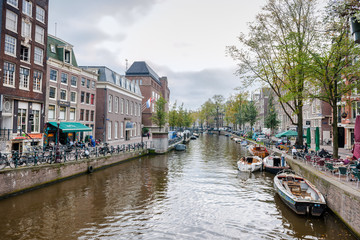 Amsterdam, Netherlands - September 27, 2011: One of the many bridges across Amsterdam canals. Amsterdam has more than 100 kilometres of canals, about 90 islands and 1,500 bridges.