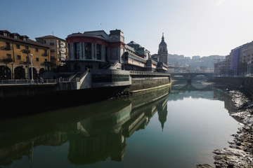 The Ribera market and the church of San Anton of Bilbao seen from the river