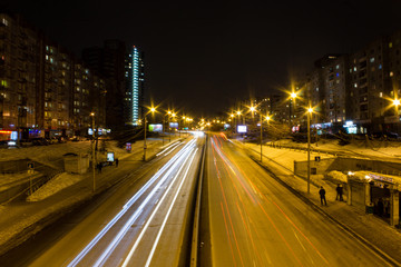 Fototapeta na wymiar night city cars road lights architecture evening headlights 