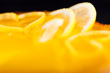 Lemon cheesecake decorated with lemon zest close up. Selective focus