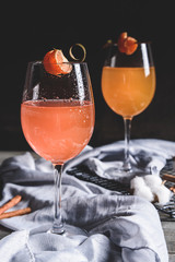 Orange cocktails on gray background