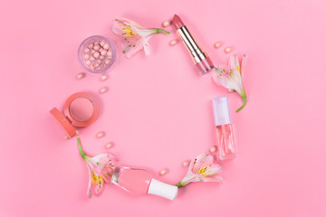  Flat lay on a pink background with makeup cosmetics. Beauty concept.