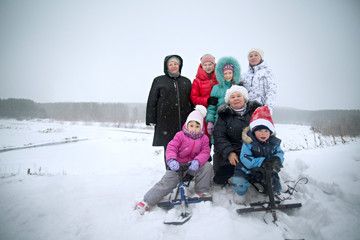 Portrait of family in meadow in winter 