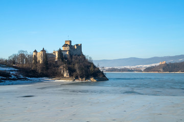 Fototapeta na wymiar Dunajec castle in Niedzica, Poland, Czorsztyn lake at winter