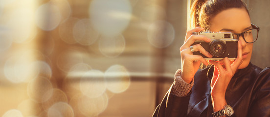 golden hour natural light girl holding retro camera commercial watch and sunglasses concept style
