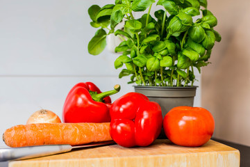 Vegetables Fresh coriander,carrot, paprika on the kitchen counter