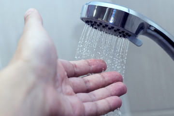 hand in the shower test water temperature