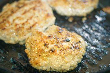 frying cutlets in a pan close-up