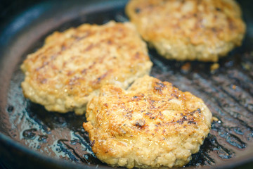 frying cutlets in a pan close-up