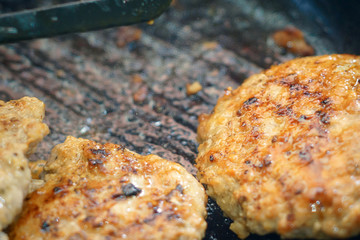 frying cutlets in a pan close-up