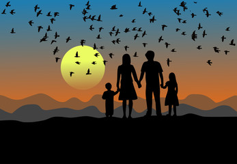 Black silhouette, parents, son and daughter are standing at sunset. There are birds flying in the sky. There is a mountain in the background.