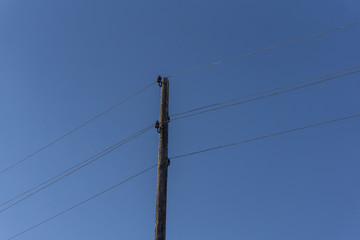 electrical wires on a wooden post