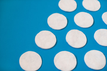 Сotton pads detergency make up on blue background