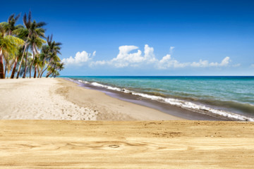 Wooden desk of free space and summer time on beach. 