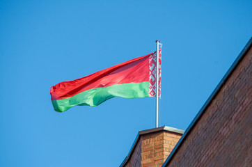 Belarusian flag against the blue sky