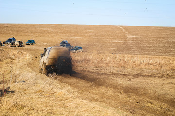 Ukrainian offroad competition in the city of Kamyanets Podilsky. Swamp and mud on cars. Produce large puddles © Yaroslav