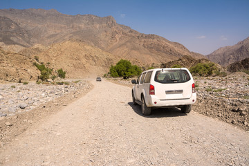 Obraz na płótnie Canvas Off-road vehicle on the Jebel Shams mountains (Oman)
