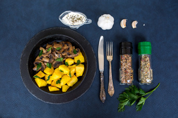 Fried potatoes with mushrooms. Dinner. Vegetable food