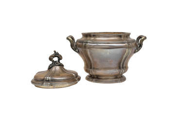 An antique silver sugar bowl with an open lid on a white background.