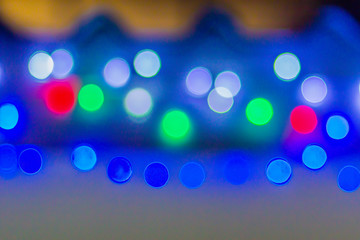 Abstract blurred circular bokeh background. Defocused background with bokeh of LED light decoration during Christmas and new year festival.