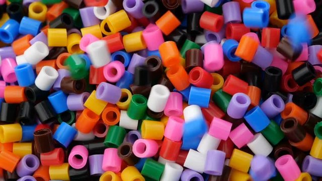 Colorful fusible plastic beads. Close up.