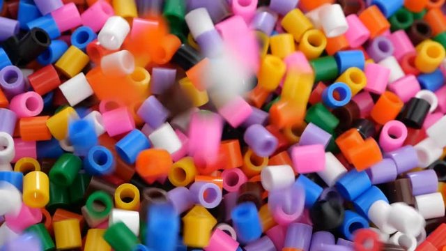 Colorful fusible plastic beads. Close up.