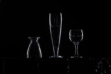 set of transparent glasses on black background 