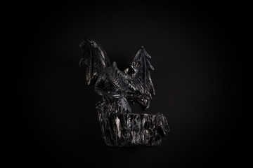 fantasy winged dragon on a black background