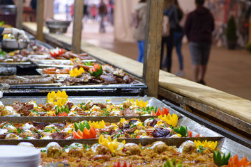 Traditional Hungarian pig slaughter dishes. Street food festival, food service. Fried pork with vegetables