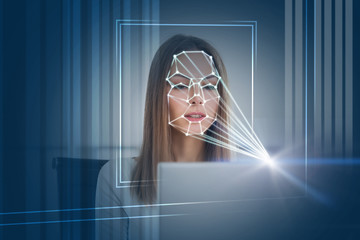 Woman with laptop face recognition technology