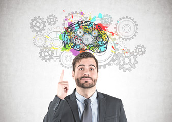 Businessman with idea, gear brain