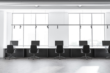 Row of tables in industrial style office