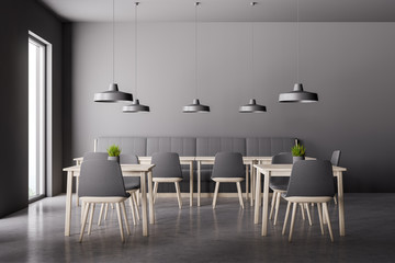 Interior of loft restaurant with sofa and chairs