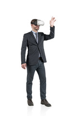 Gesturing businessman in vr glasses, isolated