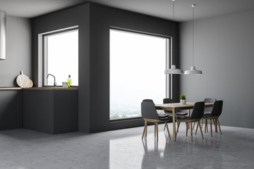 Gray kitchen corner with big window and table