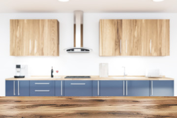 White kitchen interior with blue countertops blur