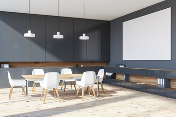 Gray meeting room corner with poster