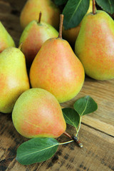 ripe pears on wooden table