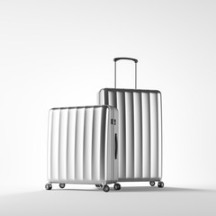 Two silver suitcases over white