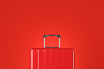 Red suitcase close up over red