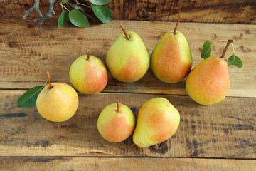 ripe pears on wooden table