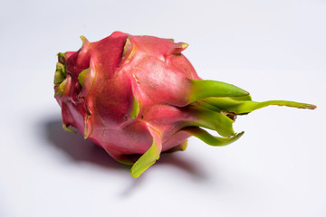 Exotic fruit. Dragon fruit. Red pitaya. Sweet pitahaya on white background. Cut the dragon fruit....