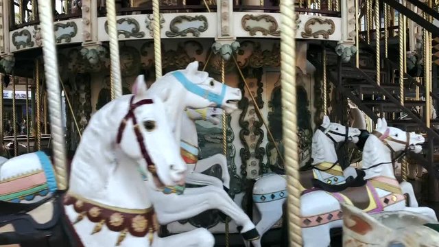 Old carousel in motion.