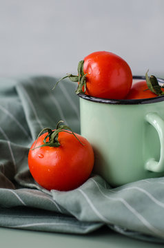 Cherry tomatos close up on green background